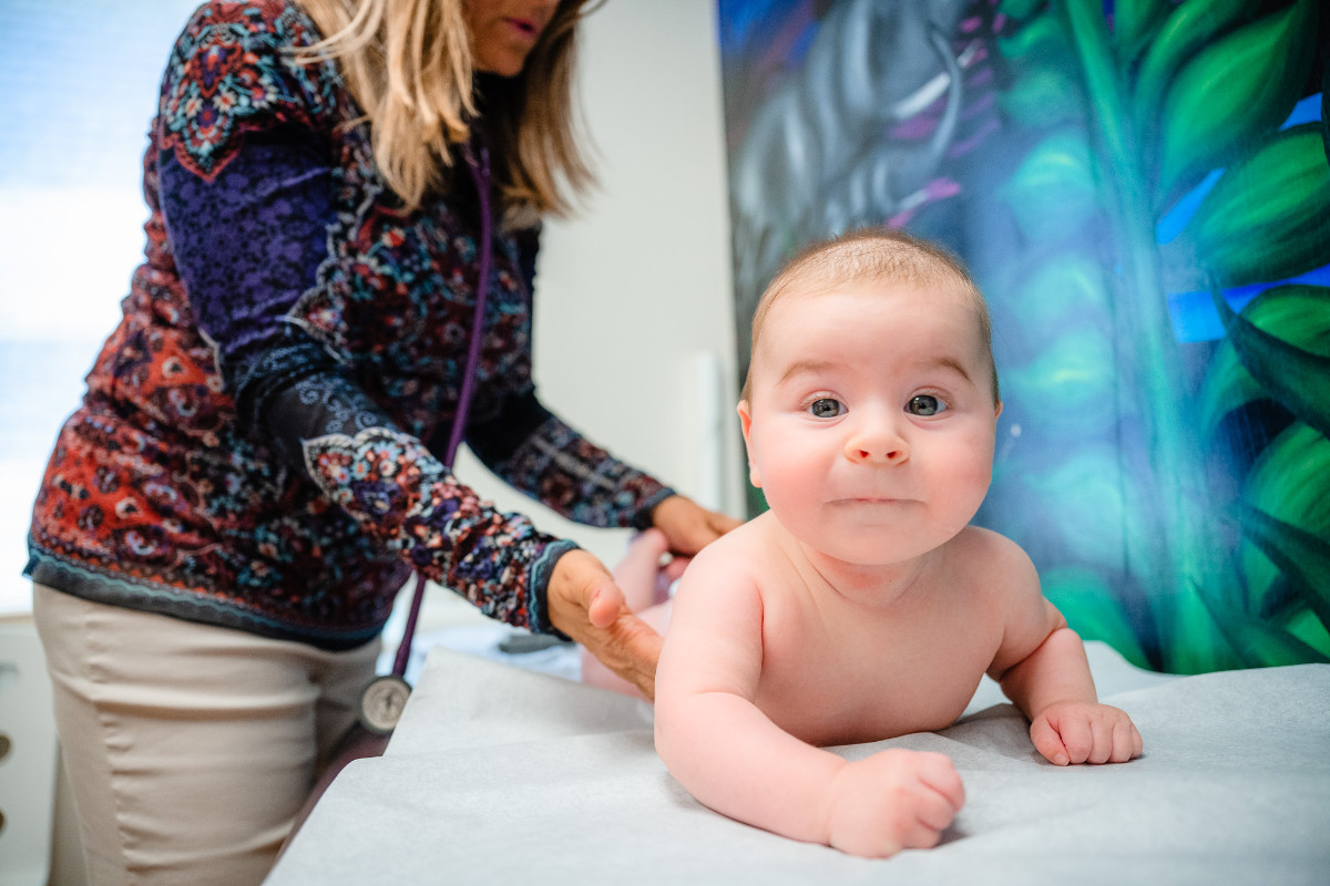 a baby on an exam table