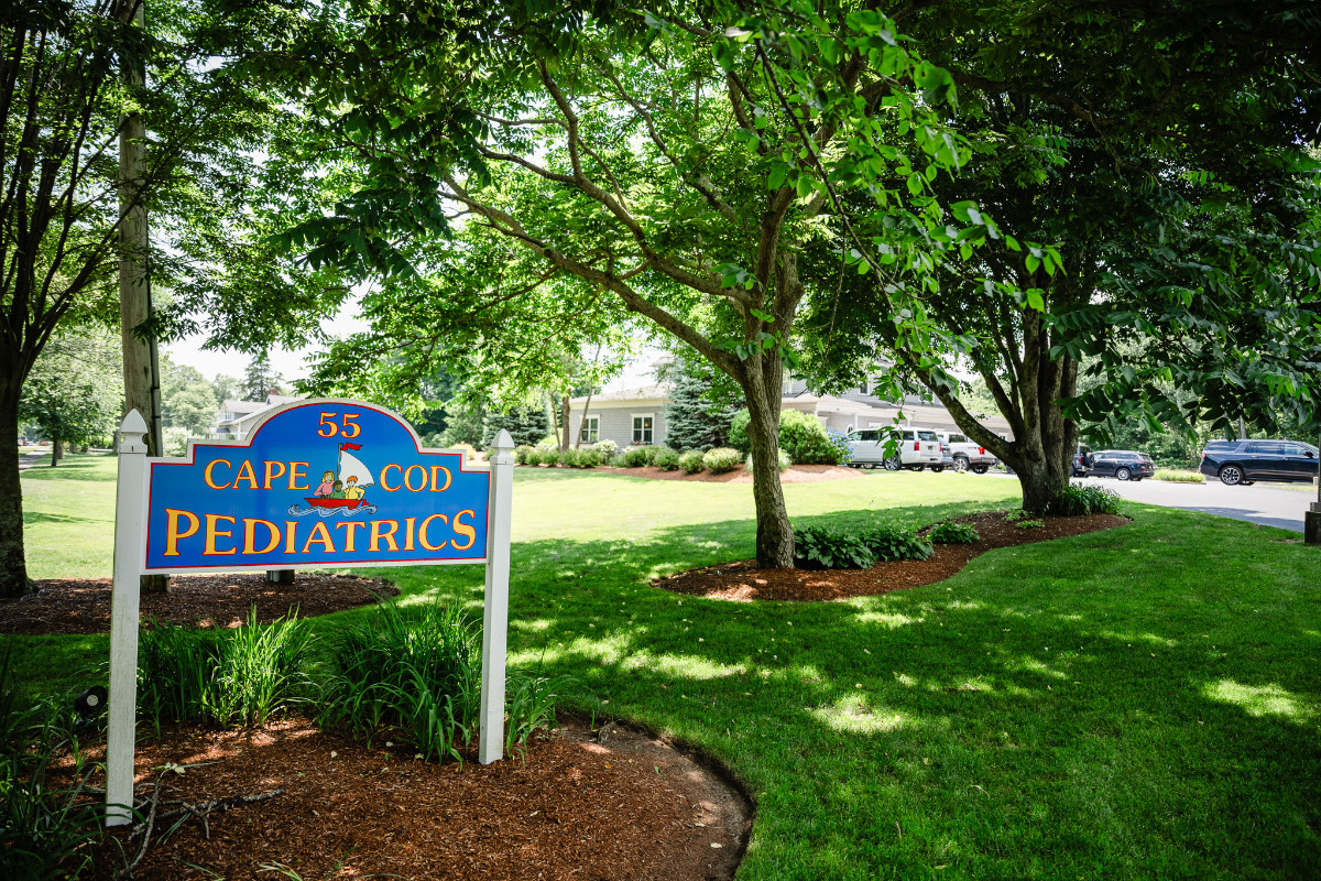 a sign on a grassy lawn