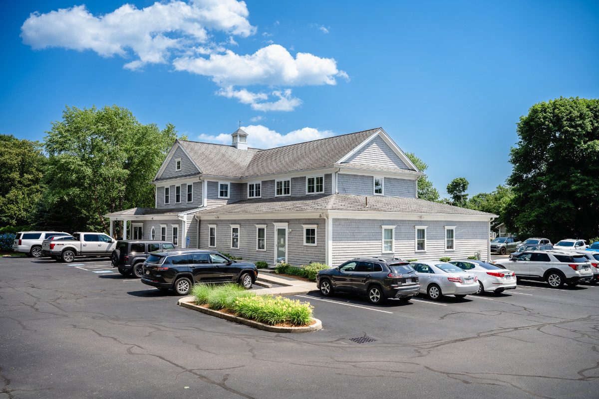 a building with cars parked in front