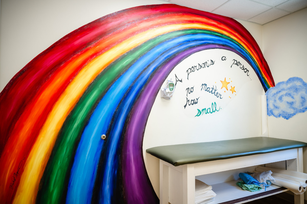 a rainbow design on a pediatric exam room wall