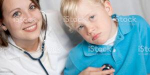 doctor examianing sick child